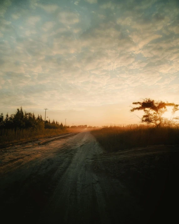 a road with a sky in the background