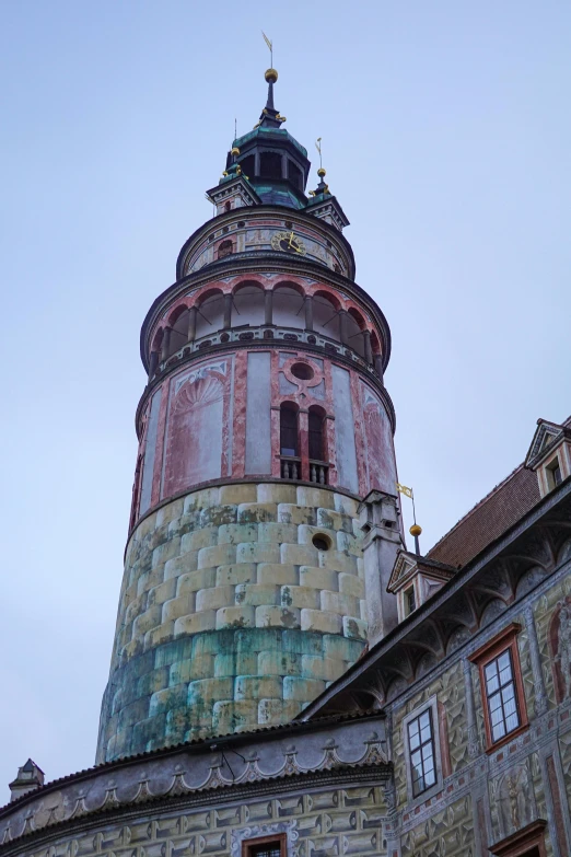 the clock tower is visible above the old buildings