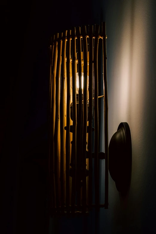 an electrical light is lit inside of a wooden panel wall