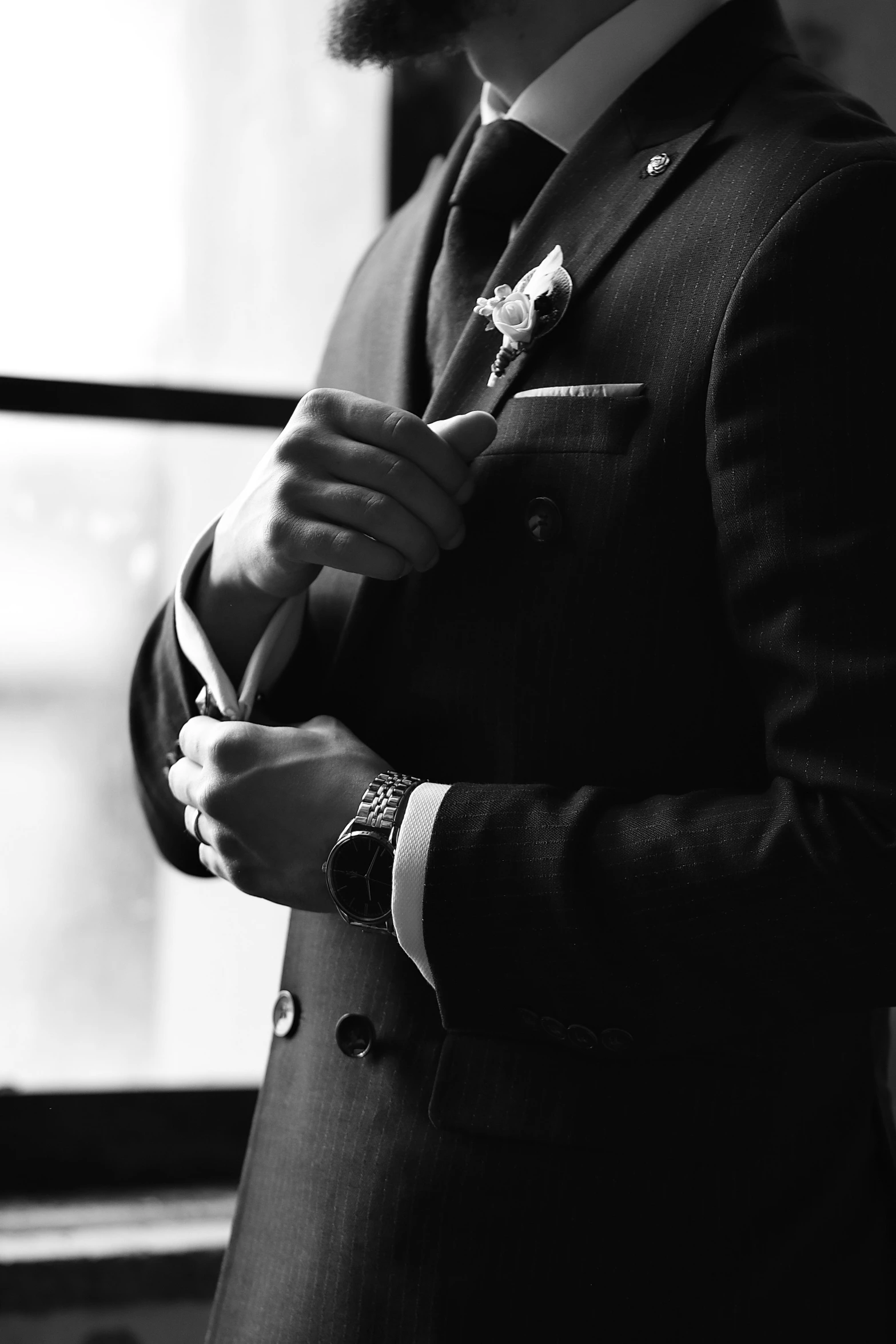 a black and white po of a man in a suit