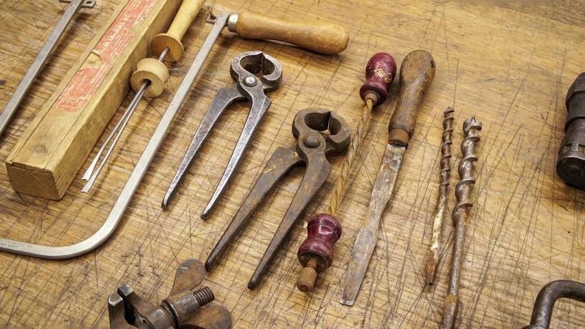 several tools that are sitting on a workbench