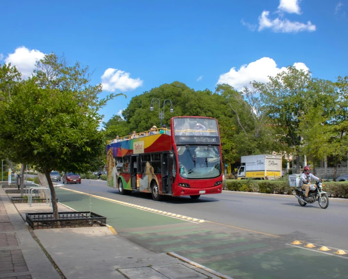 a double decker bus is making its way down the street