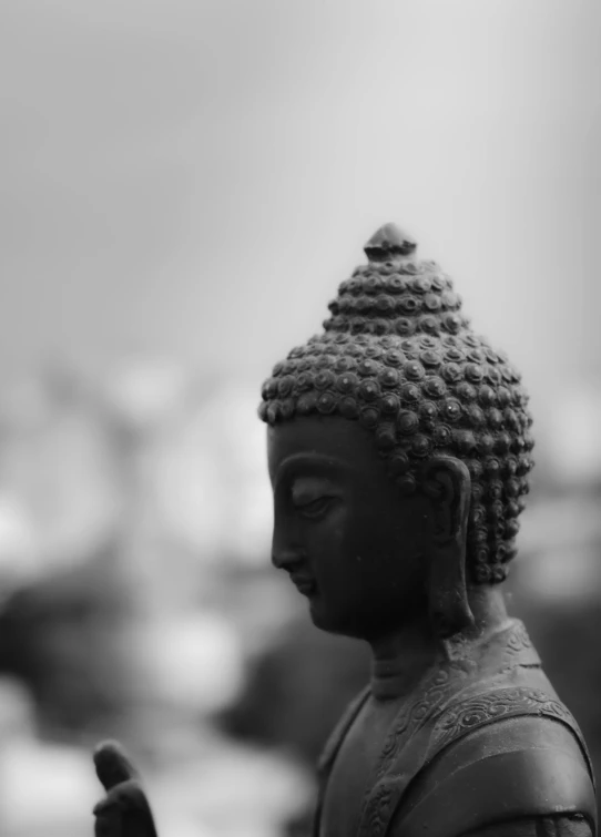 a statue of a person with the other hand up to his temple