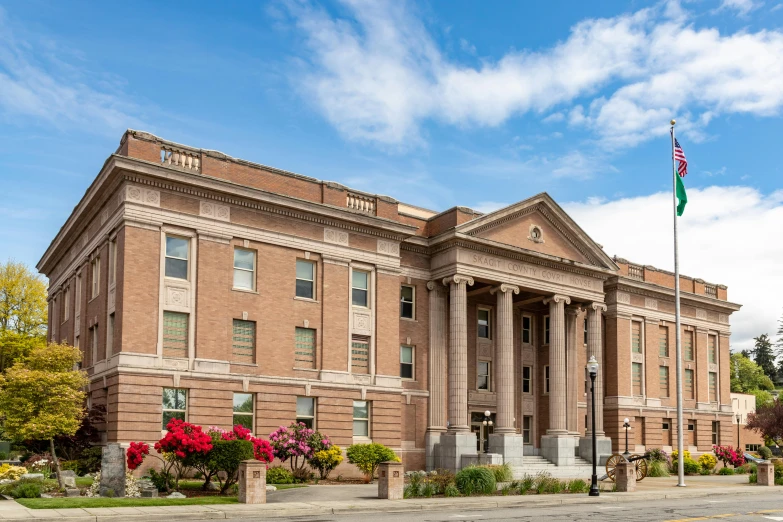 a very large, old building with a flag pole