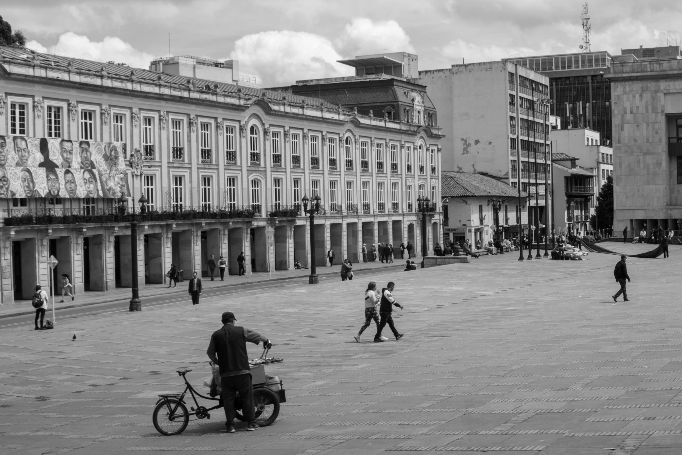 black and white pograph of people on street