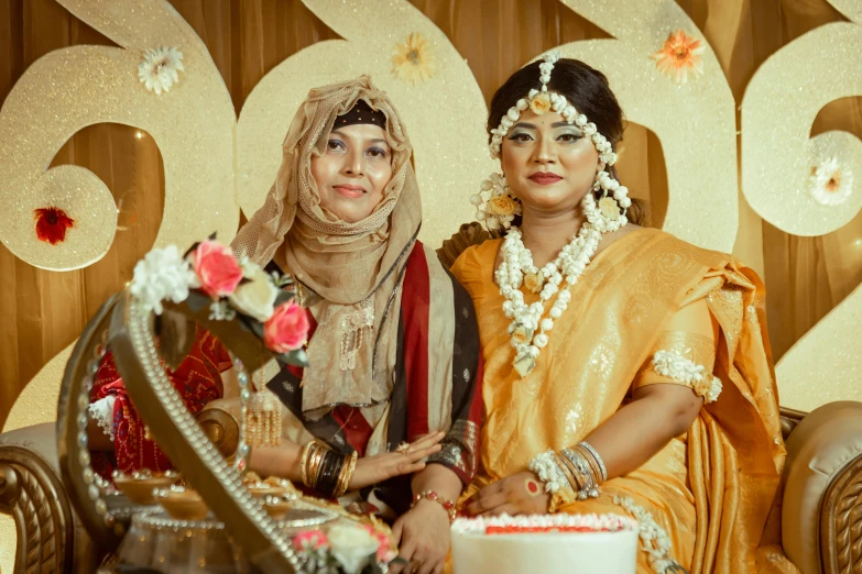 a couple wearing colorful indian attire are posing for a picture together