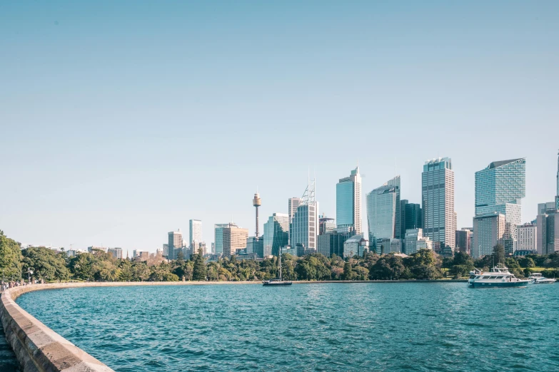 a city skyline with a boat in the water