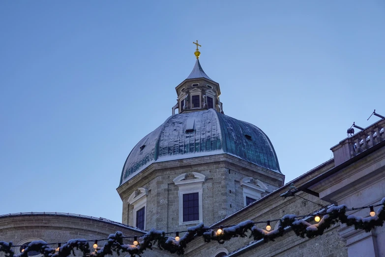 lights are strung across the roof of a building