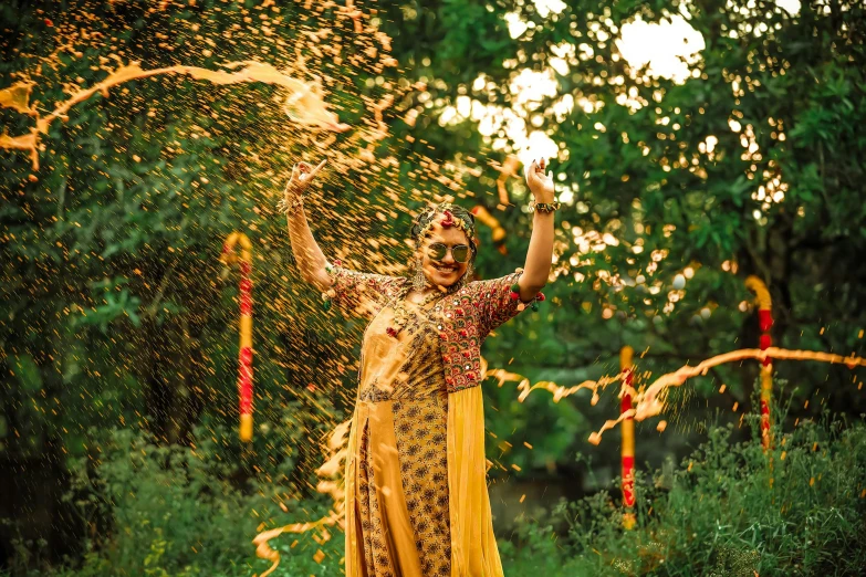 a woman in a golden outfit throwing confetti