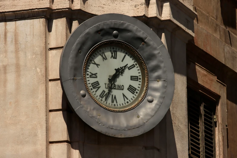 an outdoor clock on the face of a building