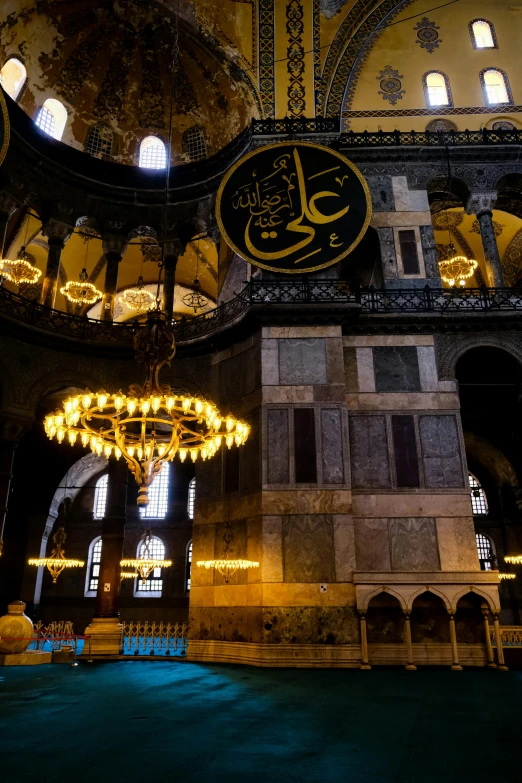 an ornate building with a large gold clock in it's center