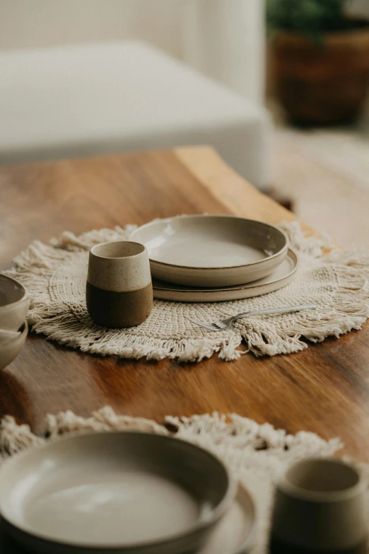 dishes and forks lie on a wooden table