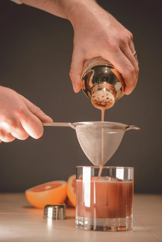 someone pours soing into a small glass bowl