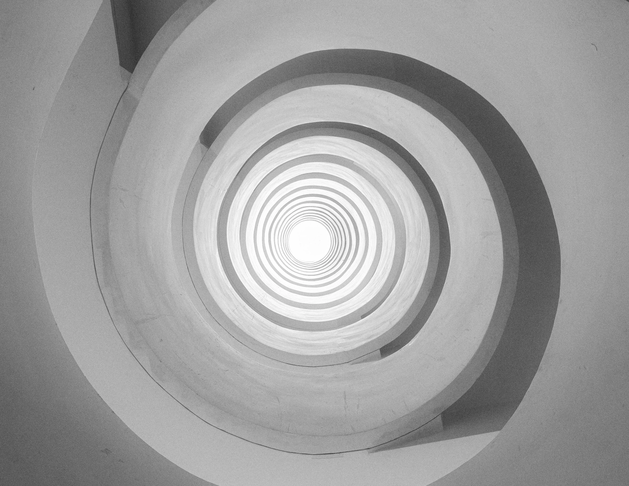 a black and white po of a spiral shape