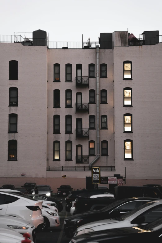 an apartment building is lit up at night