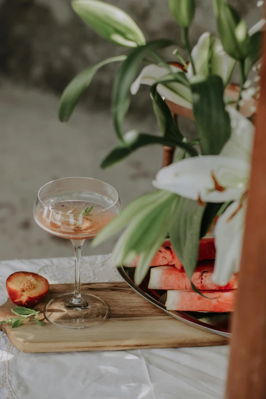 an elegant plate with an almost empty glass on it