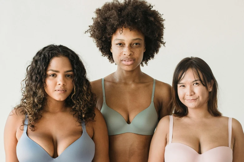 three women wearing the same  while standing next to each other