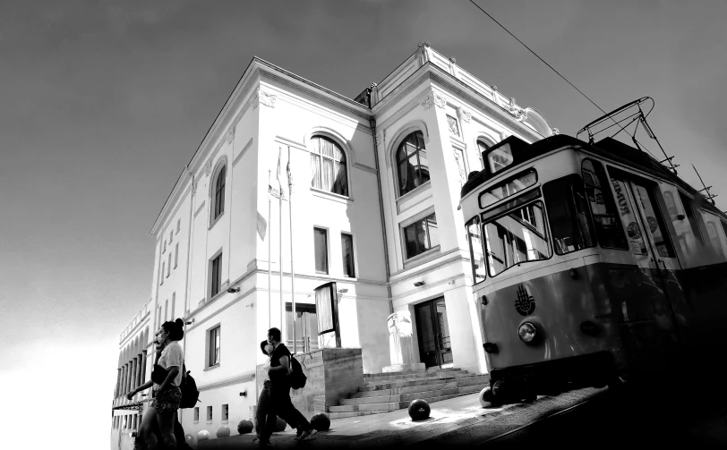 a black and white po of people walking down a steeples