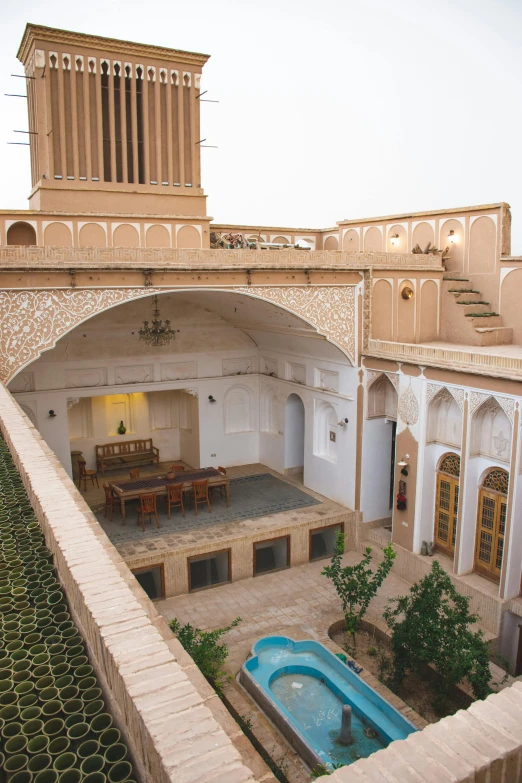 an outdoor courtyard with water fountain and outdoor seating area