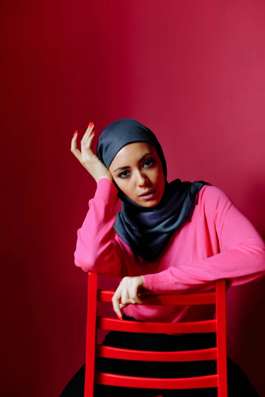 an african american woman sitting on a chair