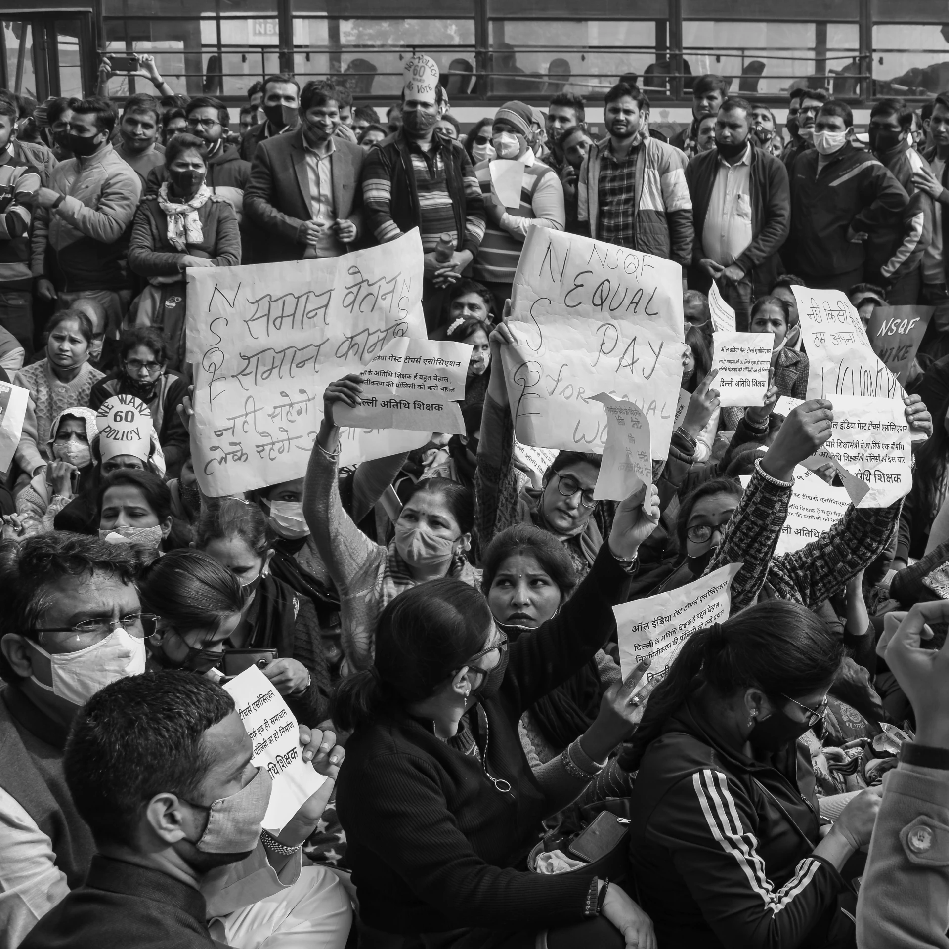 many people are holding signs and signs and posing for pictures