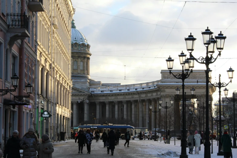 a crowded street with several people walking around