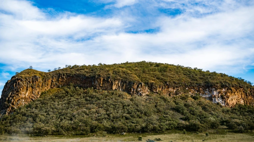 a small rock formation on top of a mountain