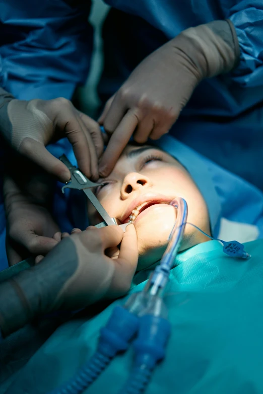 a small child being hooked up to an iv