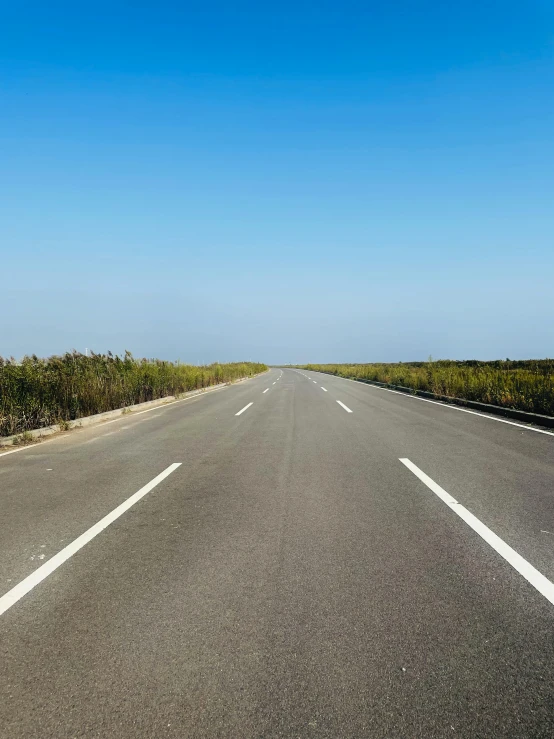 the road is wide and empty during the day