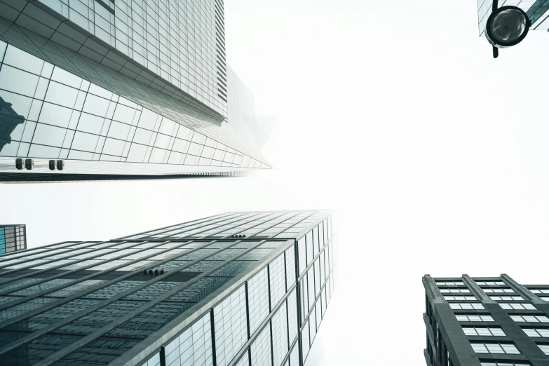 a white sky view of tall building in the middle