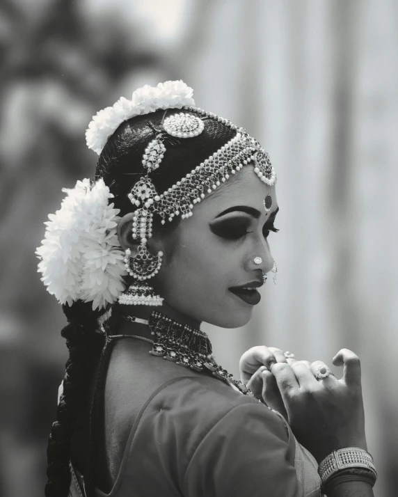 woman in indian costume with ear pieces and ring