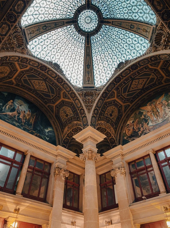 a large room with a decorative roof and windows