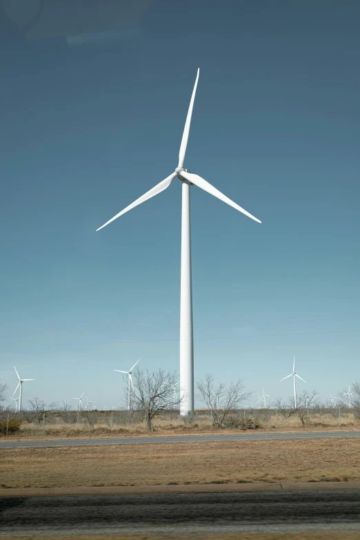 a windmill that is on a grassy field