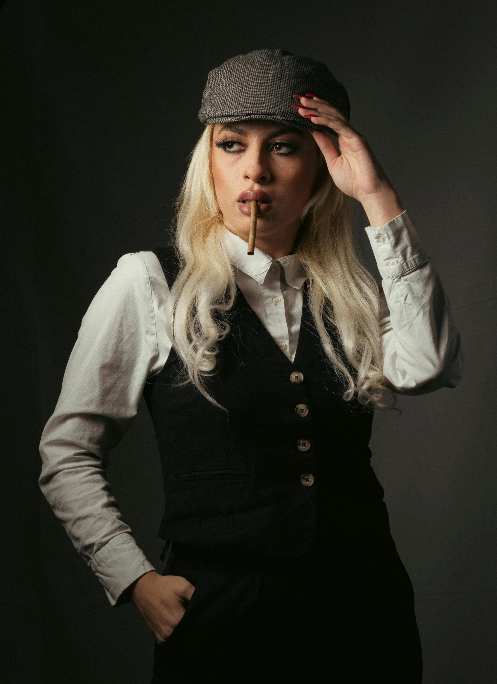 a woman posing in a dress shirt and tie