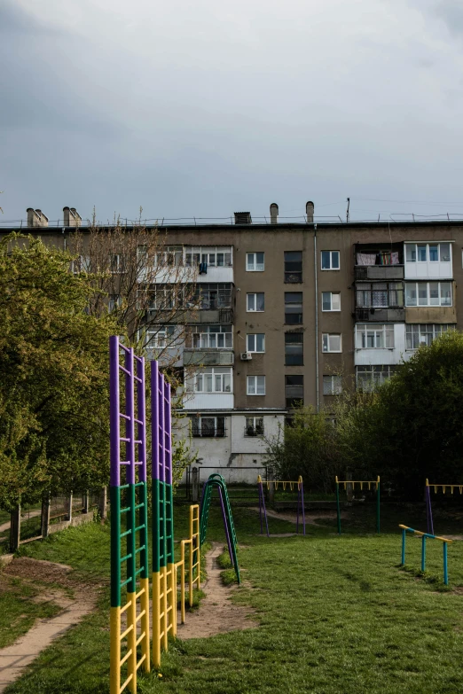 a set of colorful painted metal tubes on the grass