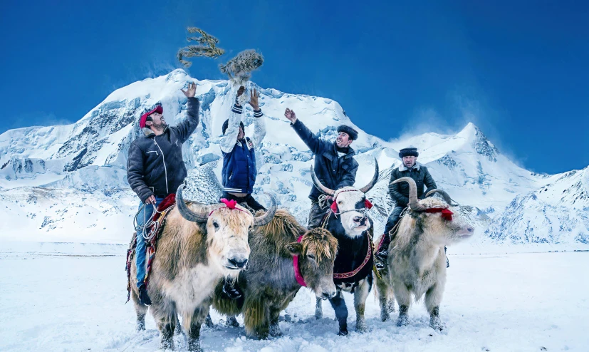 four men pose with their horses and a trophy trophy