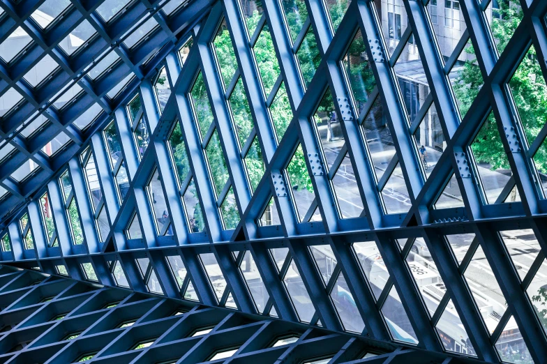 the inside of a building with steel pillars