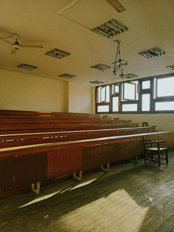 an empty room with many chairs in it