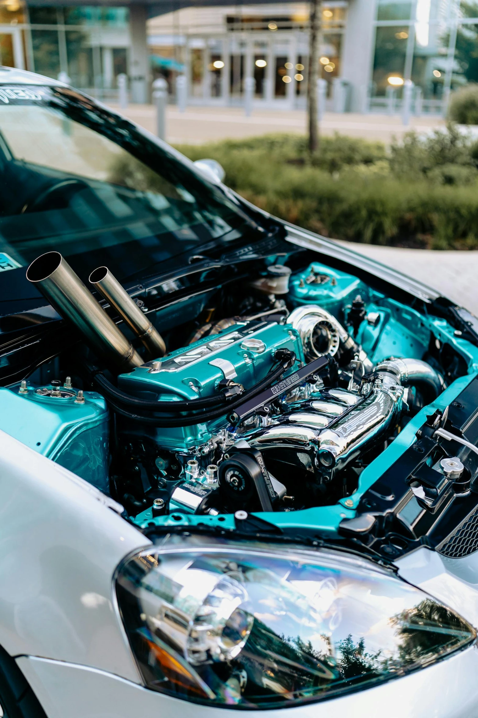 a car with a blue engine in the hood