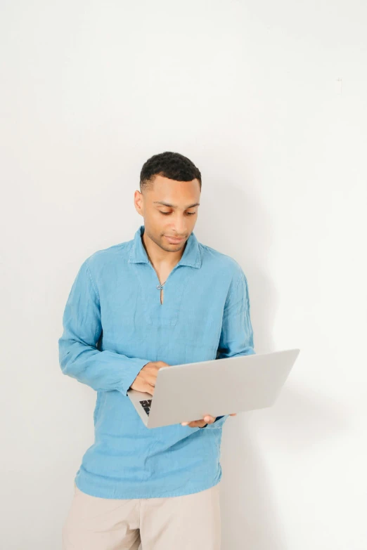 a man looking at soing on his computer