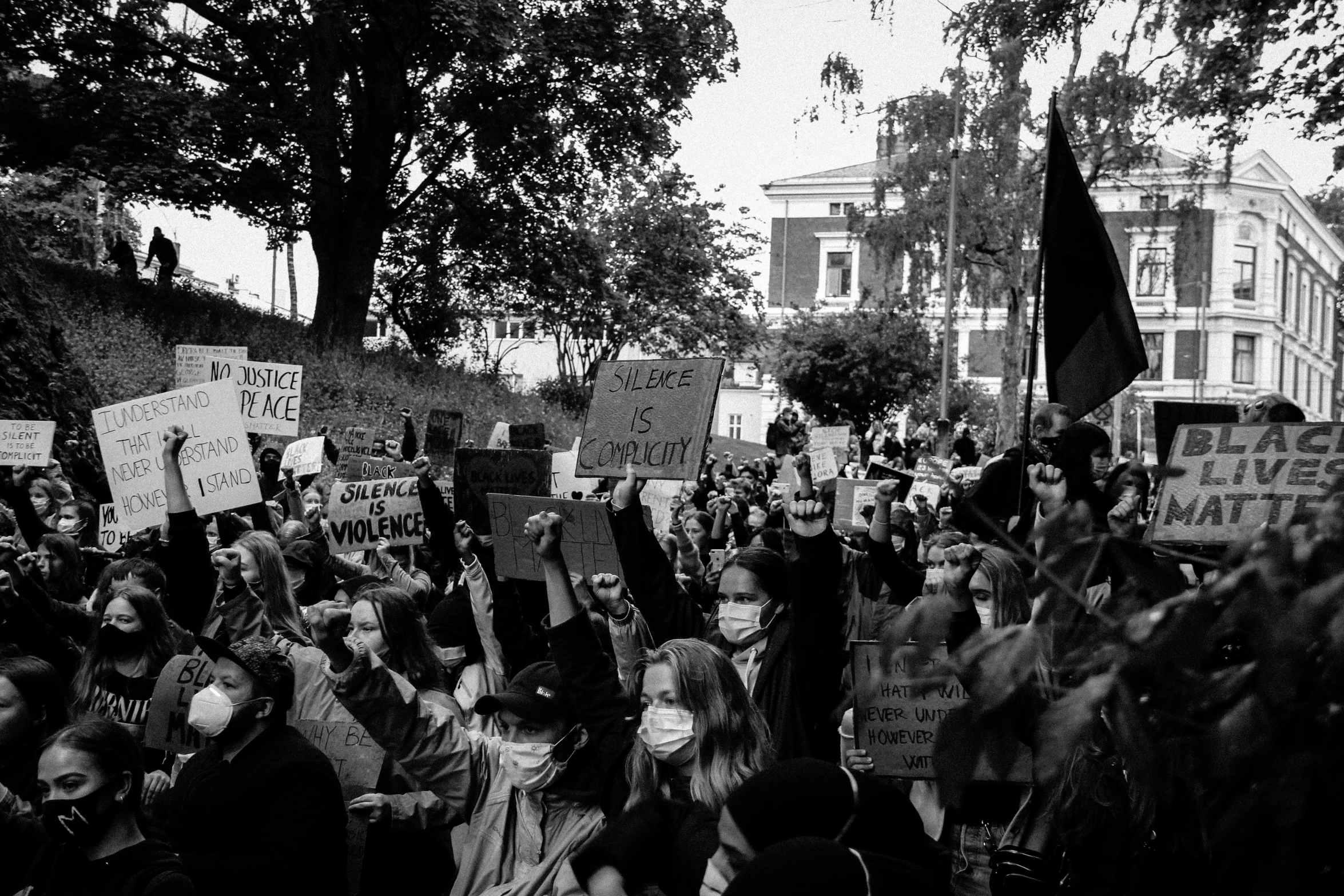 there are people protesting in a black and white po