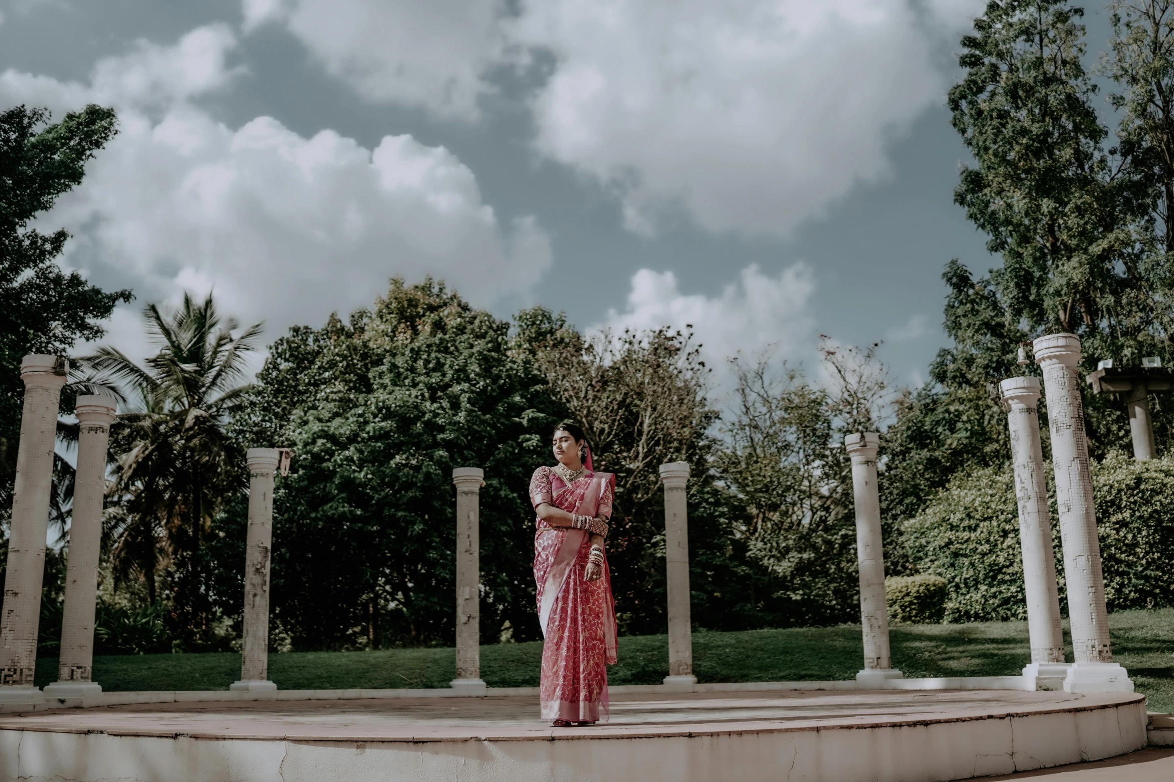 an artistic s of a lady standing on a stone steps