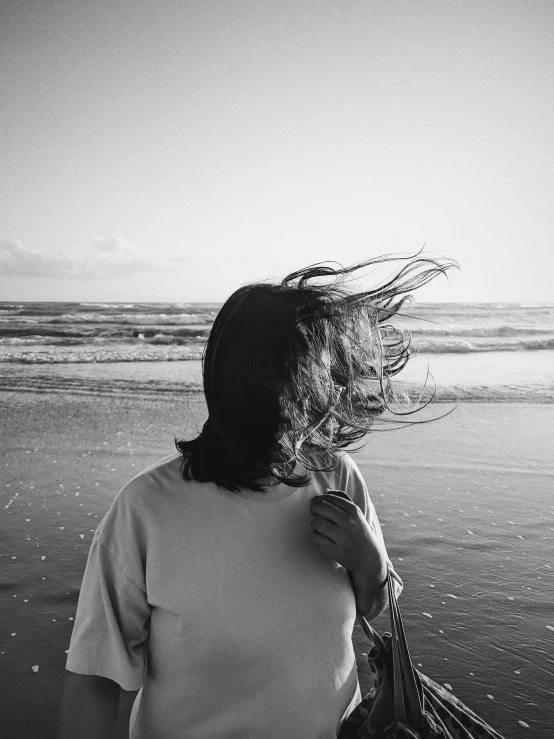 a person standing near water with their head sticking out