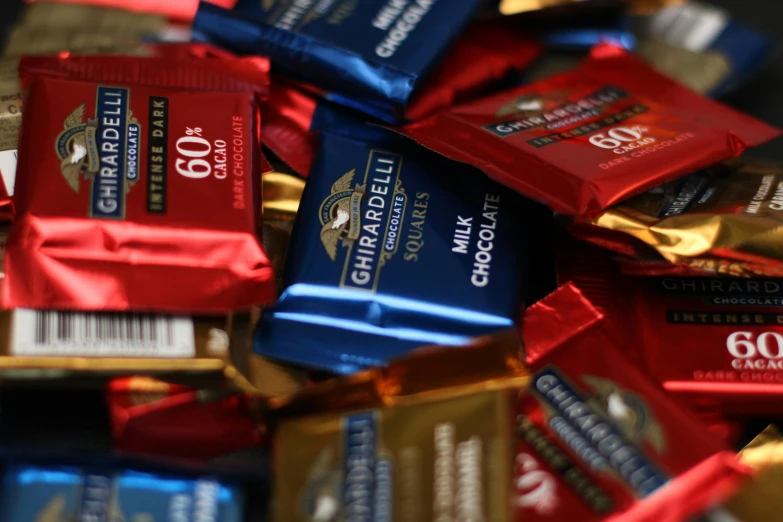 a bunch of bars of chocolate are shown stacked together