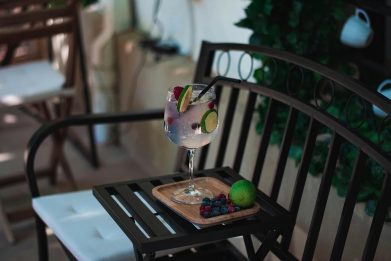 a tray with some fruit and a glass of water on a table