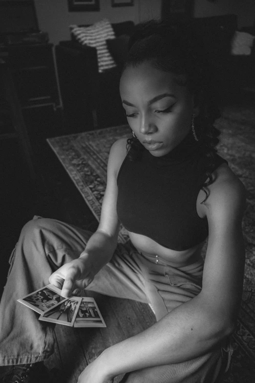 black and white image of a woman playing with cards