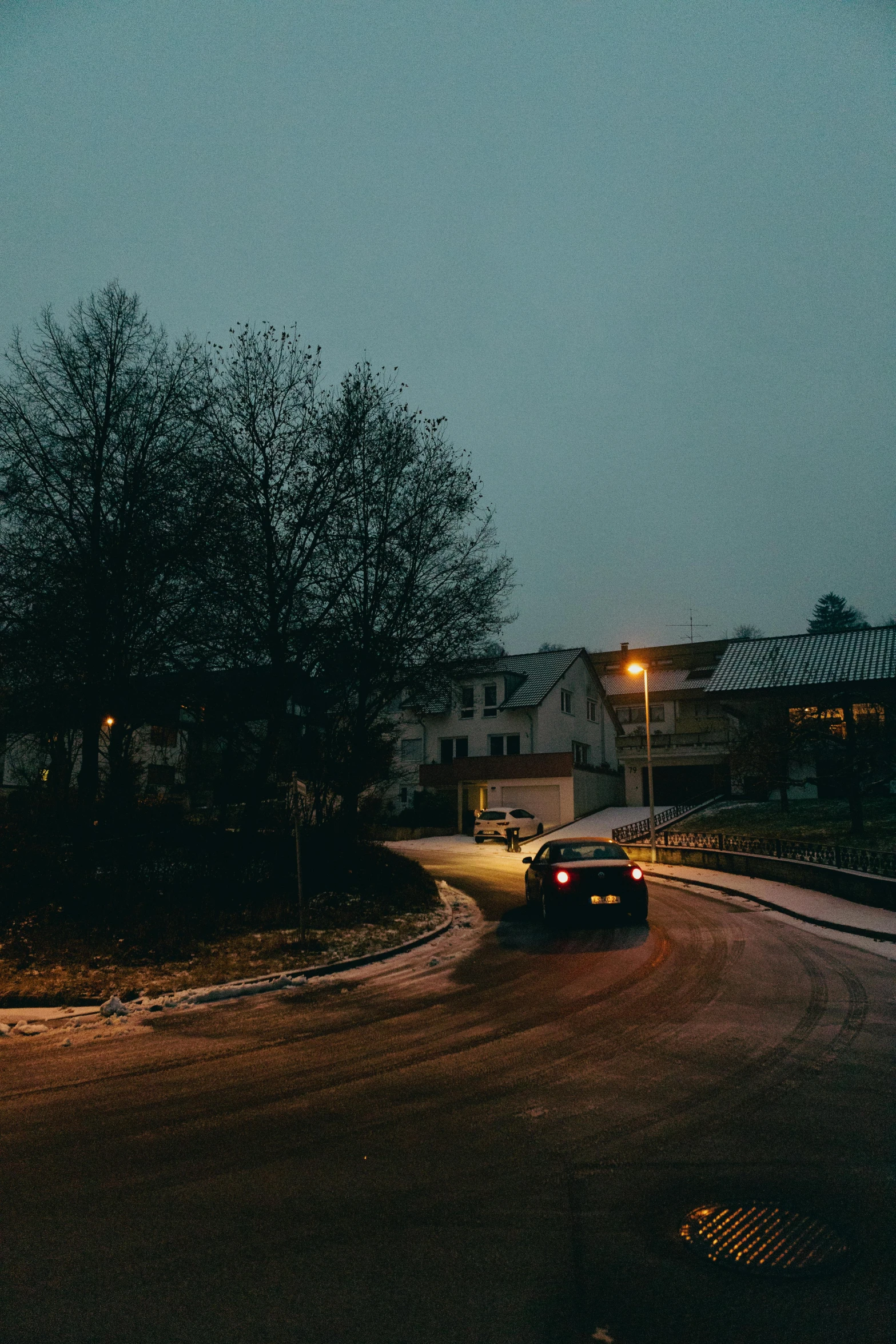 a city street at night with a very dark sky