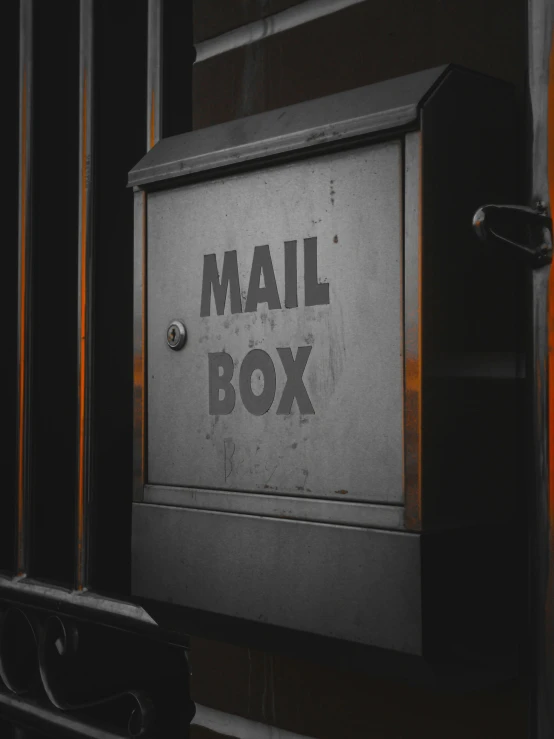 an old mailbox with mail that reads mail box