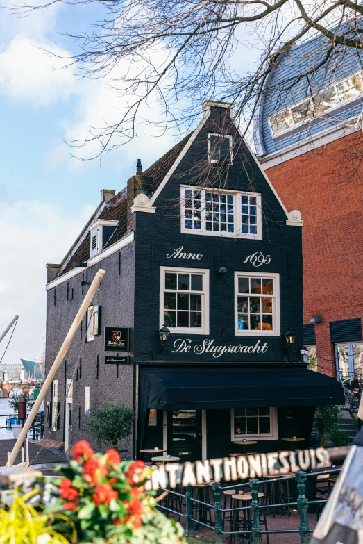 a large building with a very tall black roof