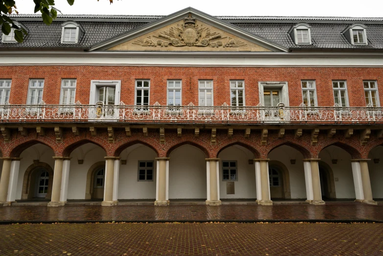 a building with several arches and columns along one wall